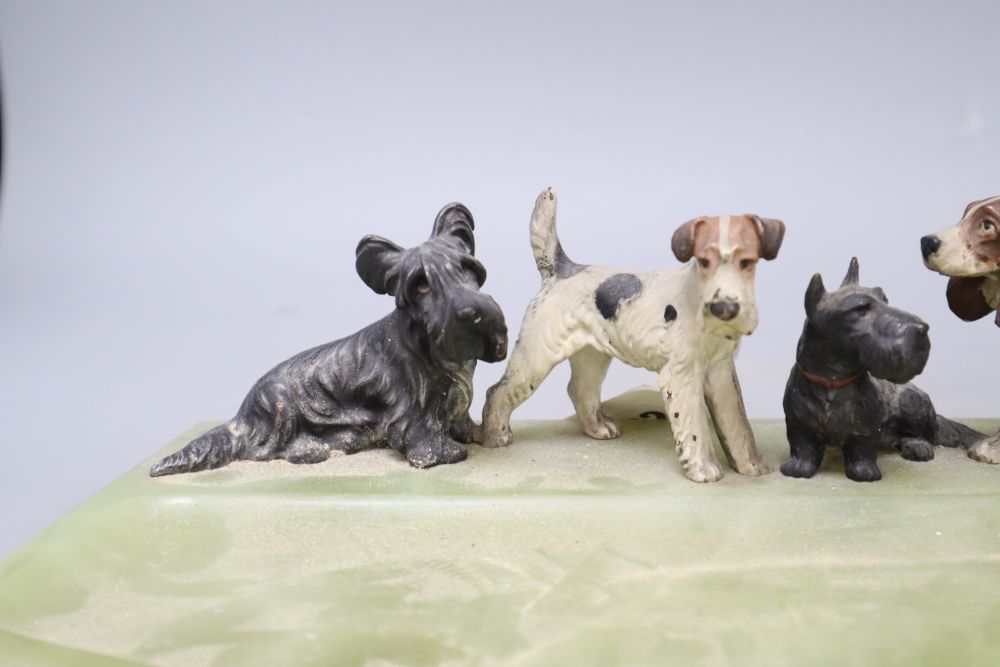 A cold painted bronze dish, modelled with terriers and a spaniel, length 36cm